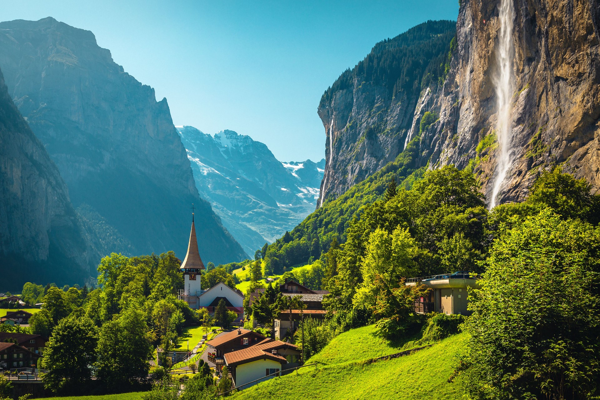 Lauterbrunnen valley view with village and high waterfall, Switzerland